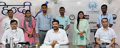 CMD speaking, presenting a book and in group with others (Photo | EPS)