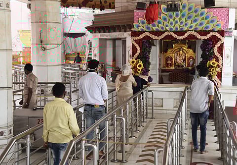 People gather at Jhandewalan Temple in Delhi on Monday to offer prayers. (File photo| Parveen Negi, EPS)