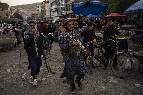 Taliban fighters patrol a market in Kabul's Old City, Afghanistan, Tuesday, Sept. 14, 2021. (Photo | AP)