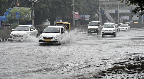 Commuters wade through a waterlogged ITO following heavy rains in New Delhi. (File| Shekhar Yadav, EPS)