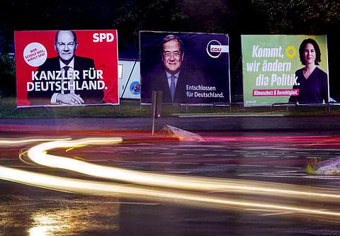 Posters show Social Democratic top candidate for chancellor Olaf Scholz, left, Christian Democratic top candidate Armin Laschet, center, and top candidate of the Greens Annalena Baerbock. (Photo | AP)