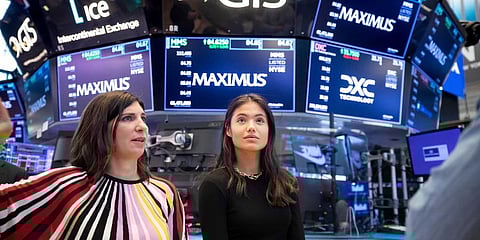 U.S. Open tennis women's singles champion Emma Raducanu, right, of Britain, at the New York Stock Exchange, Sept 14, 2021. (Photo | AP)