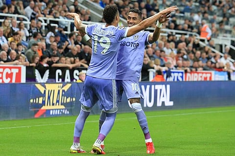 Leeds United players Raphinha Dias Belloli (R) and Rodrigo (L) celebrate after scoring goalduring match against Newcastle United at St James' Park, north east England. (Photo | AFP)