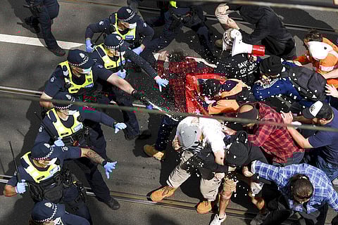 Victoria police fire pepper spray during a clash with protesters at a Rally for Freedom in Melbourne, Australia. (Photo | AP)