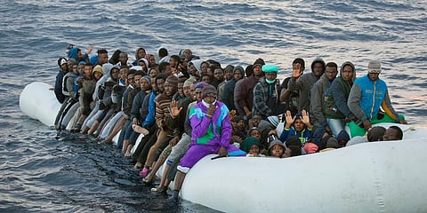 FILE: Migrants crowded aboard a rubber boat sailing out of control in the Mediterranean Sea about 21 miles north of Sabratha, Libya. (Photo | AP)
