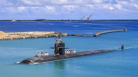 In this photo provided by U.S. Navy, the Los Angeles-class fast attack submarine USS Oklahoma City (SSN 723) returns to U.S. Naval Base in Guam. (Photo | AP)