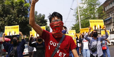 File photo anti-coup protesters gesture during a march in Yangon, Myanmar. (Photo | AP)