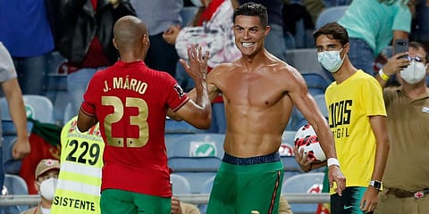 Portugal's Cristiano Ronaldo celebrates after scoring his side's second goal during the World Cup 2022 group A qualifying soccer match against Republic of Ireland at the Algarve Stadium. (Photo | AP)