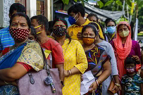 People queue up to get vaccinated against the coronavirus at a municipal health center in Kolkata. (Photo | AP)