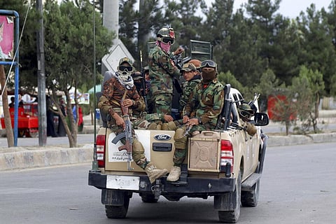 Taliban fighters arrive to the Hamid Karzai International Airport after the U.S. military's withdrawal, in Kabul, Afghanistan. (Photo | AP)