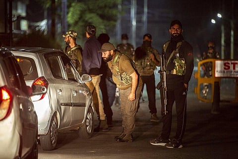 Unidentified relatives of top separatist leader Syed Ali Shah Geelani arrive outside his residence in Srinagar on September 2. (Photo | AP)