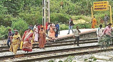 Passengers cross the tracks at Jnanabharathi Railway Station | S Lalitha