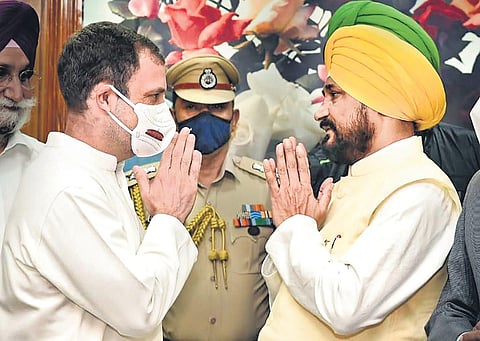 Congress leader Rahul Gandhi greets new Punjab Chief Minister Charanjit Singh Channi after the oath taking ceremony, in Chandigarh on Monday | PTI