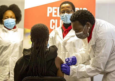A minor receives Sinovac vaccine jab from a healthcare worker in Pretoria, South Africa, Friday, Sept. 10, 2021. (Photo | AP)