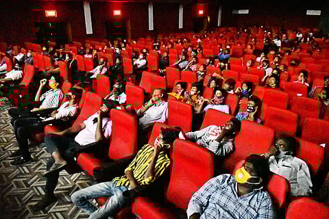 People watching a film in a single screen theatre in Vijayawada. (File Photo | Prasant Madugula, EPS)