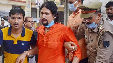 Anand Giri, the prime accused in the Mahant Narendra Giri death case, outside the district court in Prayagraj on Wednesday. (Photo: PTI)