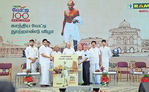 Chairman of Bharatiya Vidya Bhavan, Coimbatore, Dr B K Krishnaraj Vanavarayar, releasing a book at the Gandhiya Dhoti Centennial celebration. Managing director of Ramraj Cotton KR Nagarajan is among t