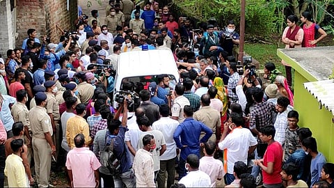 Locals gather near an ambulance carrying the body of Jyoti Prakash Behera. (Photo| EPS)
