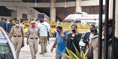 Police personnel and others at the Rohini court after the shootout. (Photo | Parveen Negi, EPS)