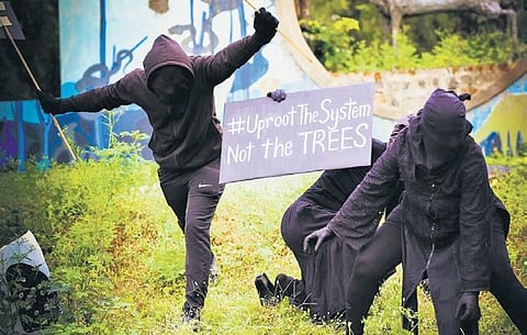 Activists with Friday for Future Hyderabad stage a novel protest at Mrugavani National Park on Friday