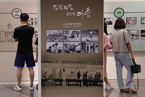Photos taken during the Korean War are displayed at the Unification Observation Post in Paju, South Korea, near the border with North Korea. (Photo | AP)