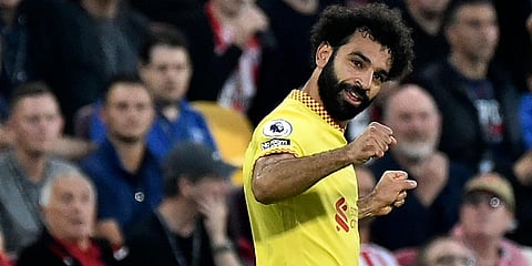 Liverpool striker Mohamed Salah celebrates after scoring his side's second goal during the EPL match against Brentford at the Brentford Community Stadium in London. (Photo | AP)