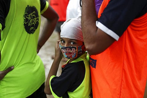 A boy wearing a face mask participate in Janmashtami celebrations in Mumbai. (File Photo | AP)