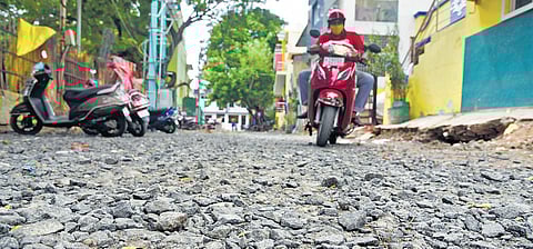 A motorist struggles to drive on the Varadarajpet Main Road at Choolaimedu. (Photo | EPS/R Satish Babu)