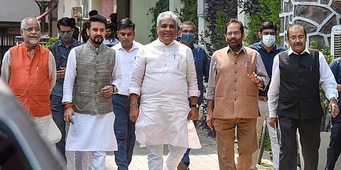 Union Ministers Bhupendra Yadav, Mukhtar Abbas Naqvi, and Anurag Thakur come out after meeting Election Commission, in New Delhi (Photo | PTI)