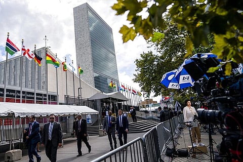 Staff and national delegations pass through a security checkpoint during the 76th Session of the U.N. General Assembly at the UN headquarters (Photo | AP)