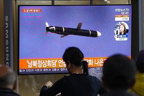 People watch a TV showing a file image of North Korea's missile launch during a news program at the Seoul Railway Station in Seoul, South Korea. (Photo | AP)