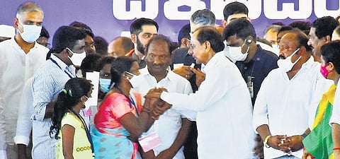 In this file photo, Chief Minister K Chandrasekhar Rao greets a Dalit Bandhu beneficiary during the public meeting in Huzurabad.