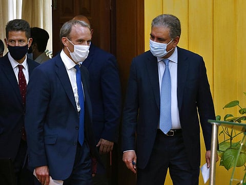 Britain's Foreign Secretary Dominic Raab, center, and Pakistan's Foreign Minister Shah Mahmood Qureshi, right, arrive for a press conference after their meeting in Islamabad. (Photo | AP)