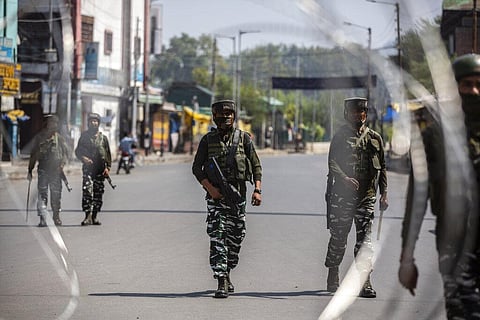 Indian paramilitary soldiers patrol a deserted market area in Srinagar. (Photo | AP)