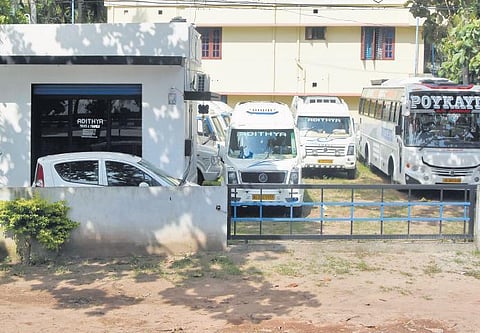 Vehicles of a private travels that used to ferry IT employees are lying idle at Kazhakootam in Thiruvananthapuram | B P Deepu