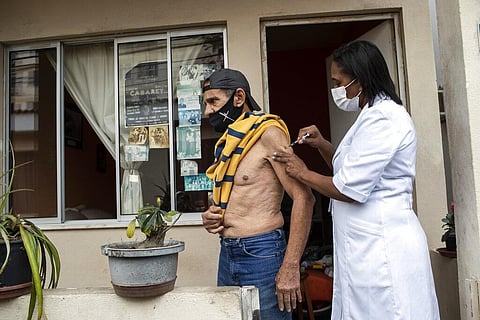 Andre Luiz da Silva, 70, is injected with a dose of Pfizer vaccine during a third dose campaign for elderly residents in Rio de Janeiro, Brazil, Sept. 1, 2021. (Photo | AP)