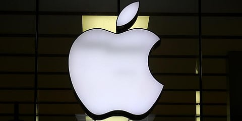 The logo of Apple is illuminated at a store in the city center in Munich, Germany. (Photo | AP)