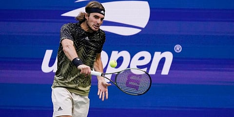 Stefanos Tsitsipas returns a shot to Carlos Alcaraz, of Spain, during the third round of the US Open tennis championships in New York. (Photo | AP)