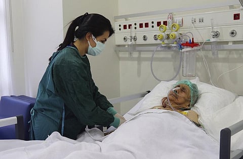 A nurse monitors Ayse Karatay at the City Hospital in Eskisehir, western Turkey, Saturday, Sept. 4, 2021. (Photo | AP)