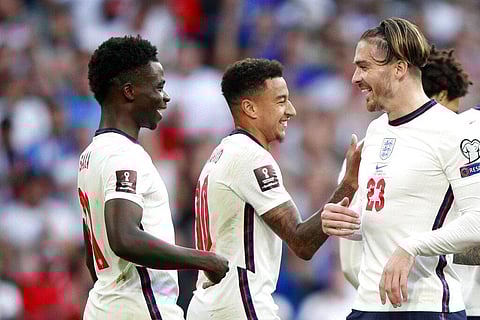 England's Bukayo Saka, left, reacts after scoring his side's fourth goal during the World Cup qualifying match aGAINST Andorra at Wembley stadium in London, Sept. 5, 2021. (Photo | AP)