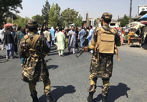 Taliban soldiers stand by as Afghans shout slogans during an anti-Pakistan demonstration, near the Pakistan embassy in Kabul, Afghanistan, Tuesday, Sept. 7, 2021. (Photo | AP)