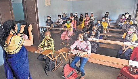 A teacher conducts a class in a school in Bengaluru on Monday. (Photo | Vinod Kumar T/EPS)