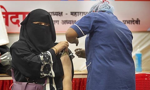 A health worker administers the vaccine for COVID-19 in Mumbai, India, Thursday, Sept. 2, 2021. (Photo | AP)
