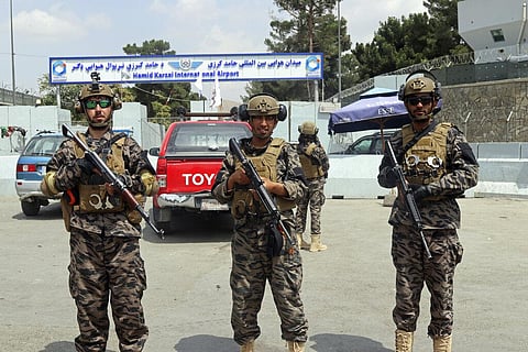 Taliban special forces fighters stand guard outside the Hamid Karzai International Airport. (Photo | AP)