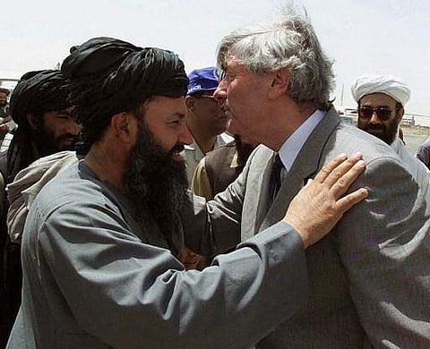 FILE | Mullah Mohammad Hasan with .N. High Commissioner for Refugees Ruud Lubbers in Kandahar, Afghanistan, 01 May 2001. (Photo | AFP)