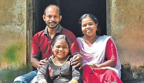 Devipriya with her parents Jayachandran G and Rekha in front of their house at Mangattumoola near Attingal | B P Deepu