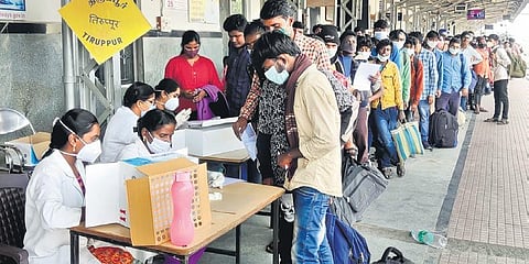 Migrant workers gathered in large numbers at Tiruppur Railway Station on Sunday, Jan 9, 2022. (Photo | Express)