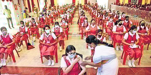 A student gets vaccinated at CSI Ewart School in Chennai on Saturday, Jan 8, 2022. (Photo | EPS, R Satish Babu)