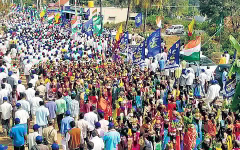 Congress workers and others take part in the Mekedatu padayatra on Monday which was launched by the party at Cauvery Sangama in Kanakapura taluk of Ramanagara district, on Sunday