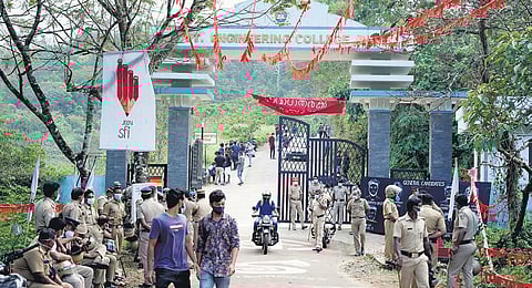 Police officers guard the Government Engineering College in Painavu following the death of SFI activist Dheeraj Rajendran on Monday | Express